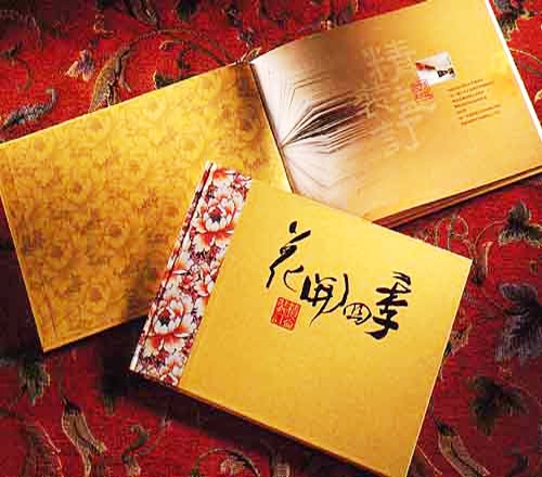 Gold premium book and open printed spread
